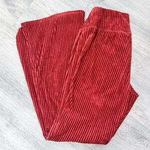 Orange crushed velvet ribbed flare pants